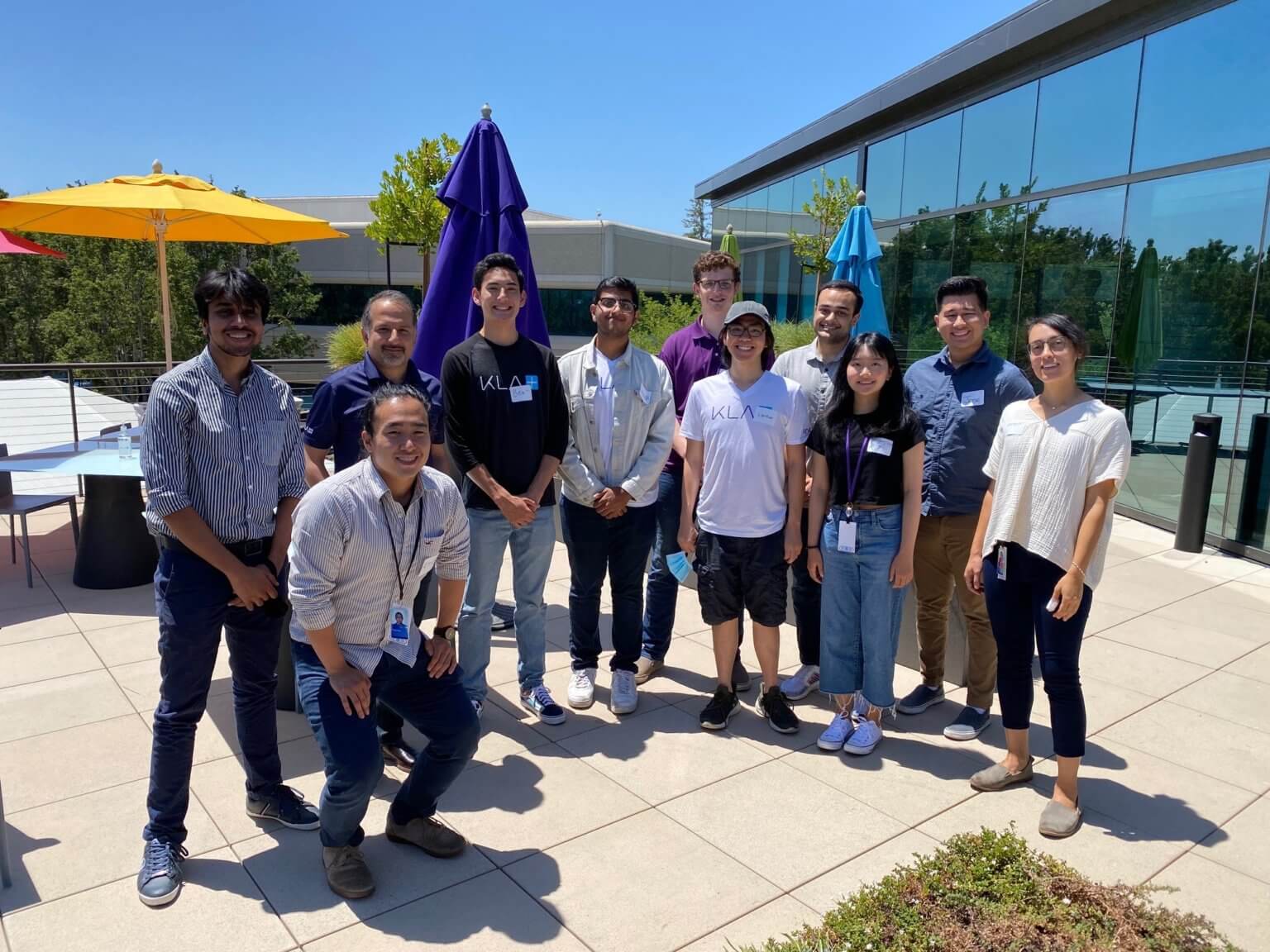 Interns pose after having lunch with Ahmad Khan, KLA's president of semiconductor process control, in Milpitas, California.