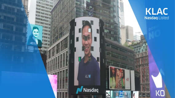 Picture of KLA employee on building-facade in New York City during the KLA Nasdaq launch